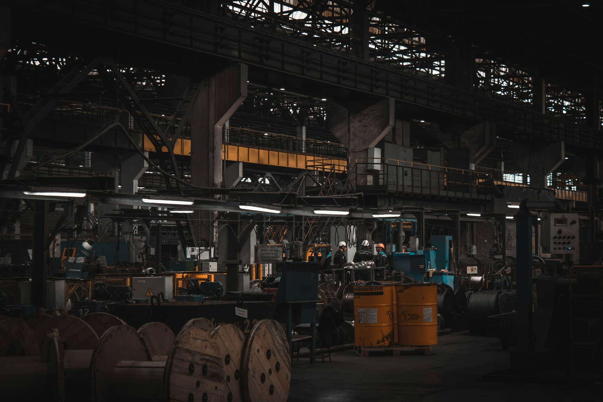 Industrial manufacturing facility with production machinery and engineering personnel